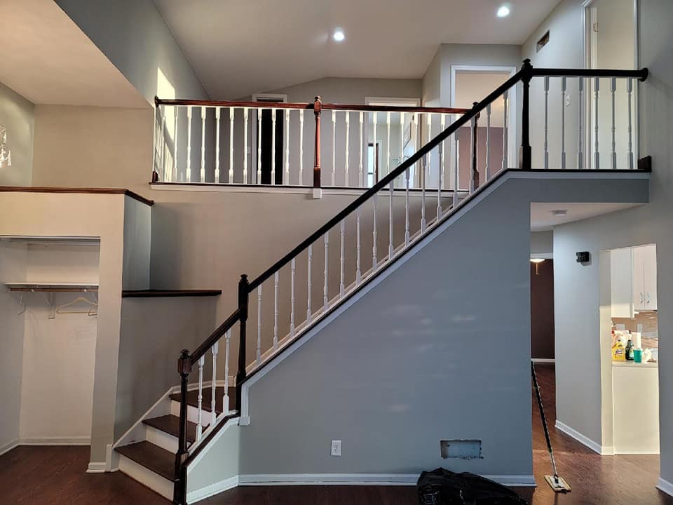 Image of remodeled living space with stair case